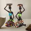cBeautiful Finish Uniquely Hand Crafted Home Decor Sitting African Tribal Women with Candle Holder Art Piece - (Set of 2, MultiColor)