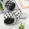 Highquality Satin White Ribbon Adorned With Black Paw Prints Ideal For Creative Crafts Petthemed