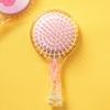 Hairbrush With Built-In Hair Tie